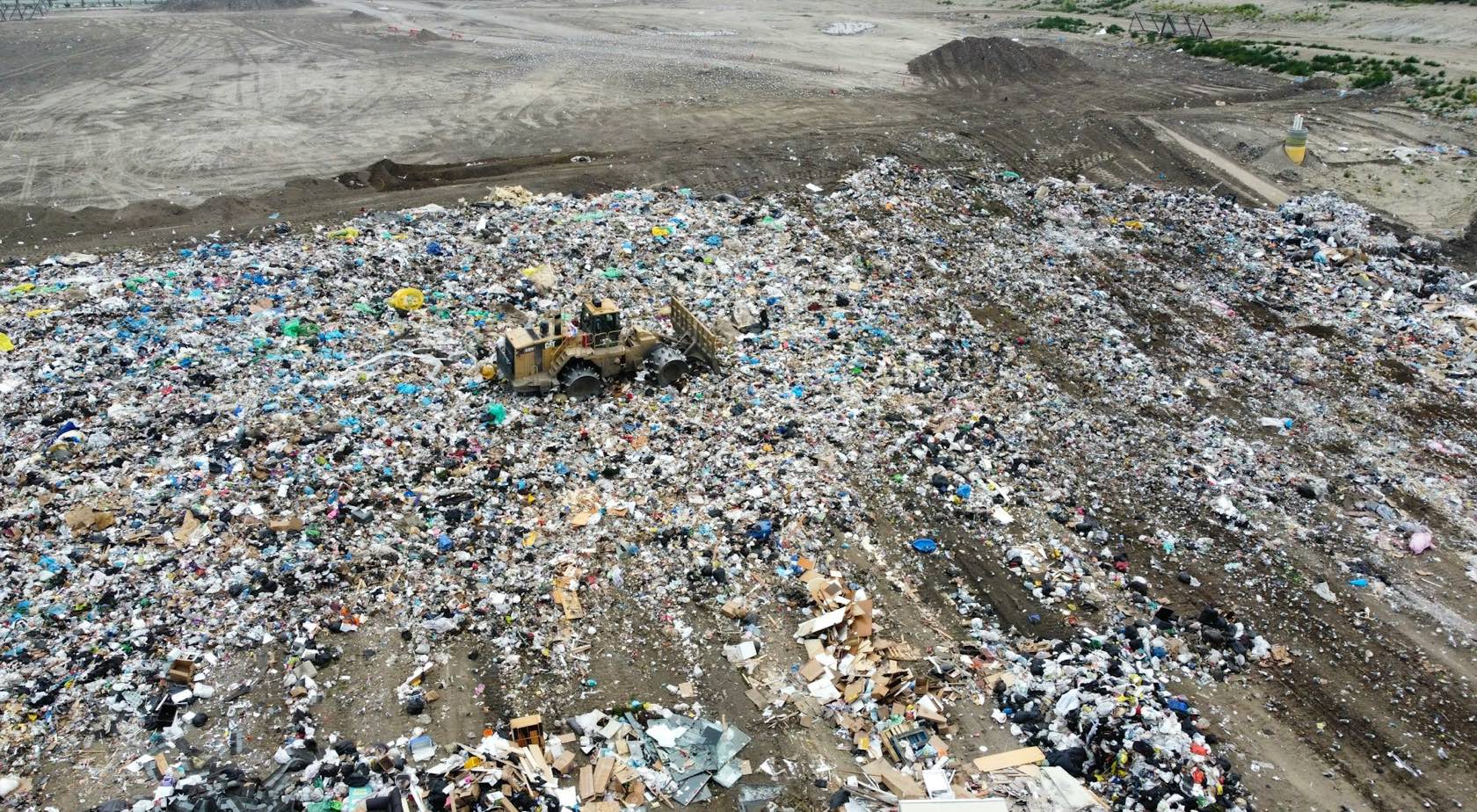 Aerial view of a landfill working face with a compactor